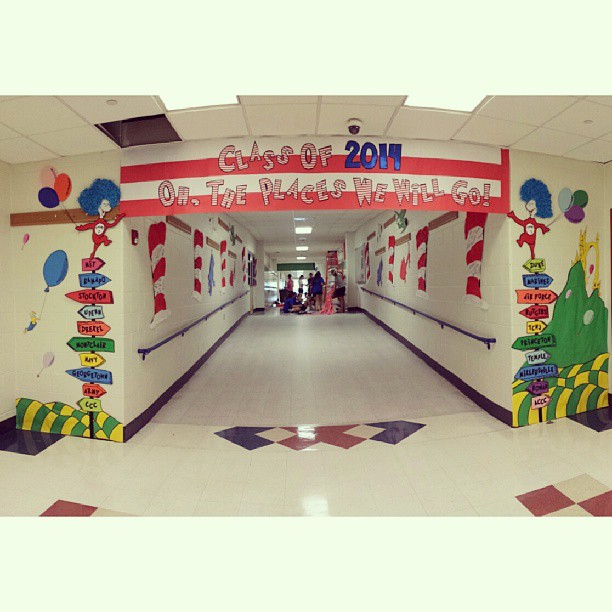 Senior Class Homecoming Banner appears over the Dr. Suess-themed hallway.