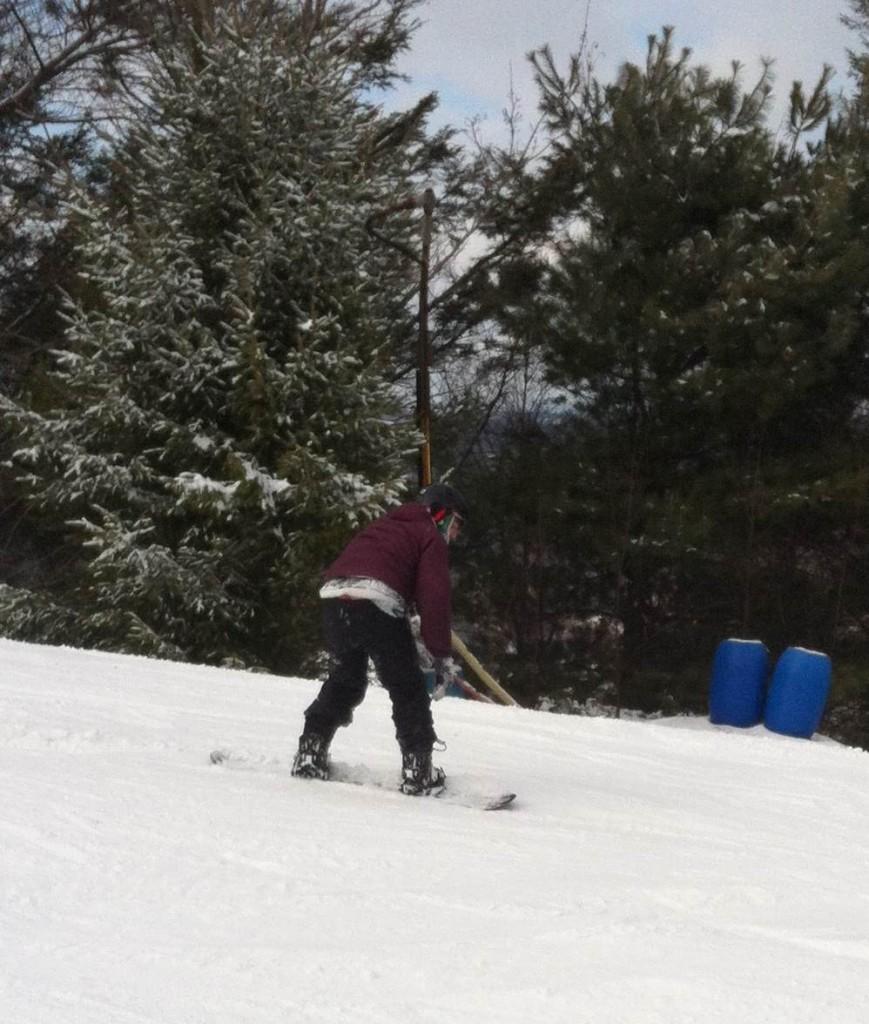 Mr. Ian Tapp tries to snowboard down the bunny trail