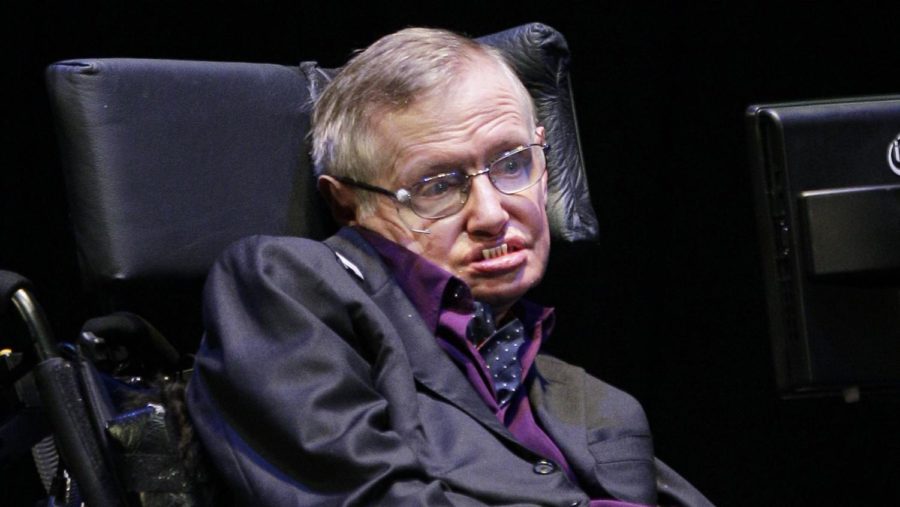 Physicist and best-selling author Stephen Hawking presents a program, Saturday, June 16, 2012, in Seattle. Hawking was taking part in the Seattle Science Festival Luminaries Series focusing on the topic of evolution. (AP Photo/Ted S. Warren)