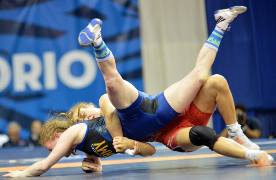 Reigning world champion Helen Maroulis of Huntington Beach, Calif., takes down Sgt. Whitney Conder en route to a 10-0, 11-0 victory in the womens freestyle 53-kilogram best-of-three finals of the 2016 U.S. Olympic Wrestling Team Trials on April 10 at Carver-Hawkeye Arena on the University of Iowa campus in Iowa City. (U.S. Army IMCOM photo by Tim Hipps) #RoadToRIo #WCAP #ArmyTeam #USAWrestling